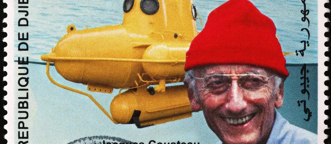 Jacques Cousteau and his bathyscaphe on postage stamp