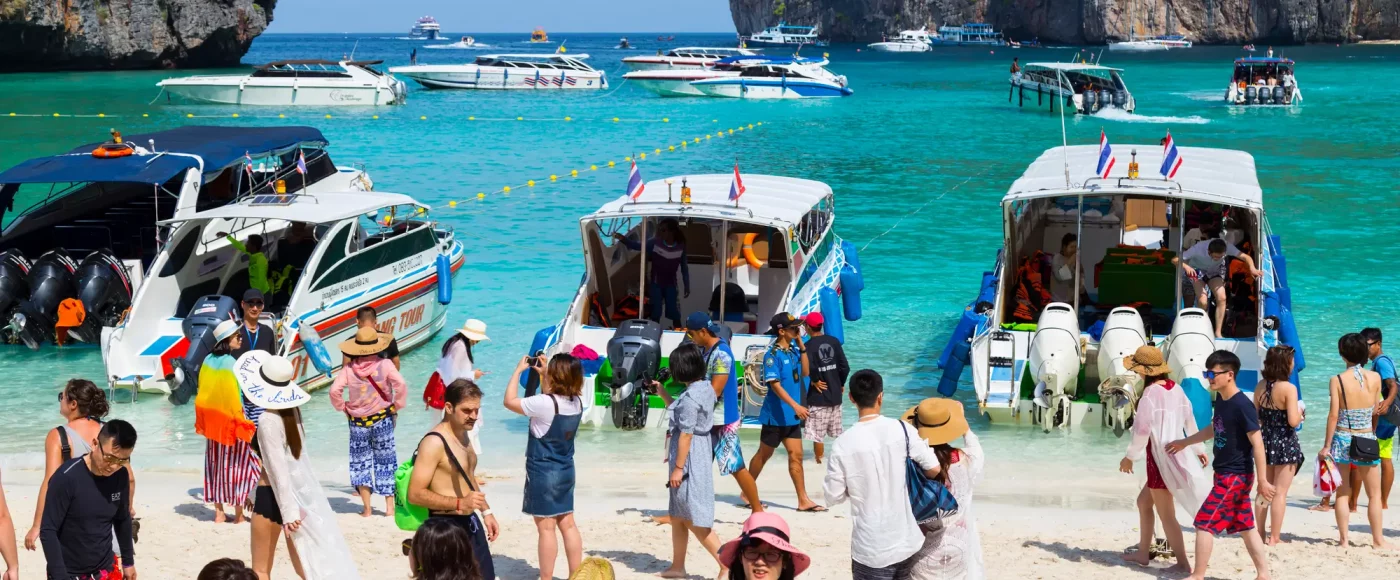 Maya Bay, seen above, made globally famous by the 2000 film The Beach, saw an influx of tourists that led to severe pollution and coral destruction. To address the environmental damage, authorities closed the bay to tourists for over three years. It reopened in 2022 with stricter regulations to protect its ecosystem.